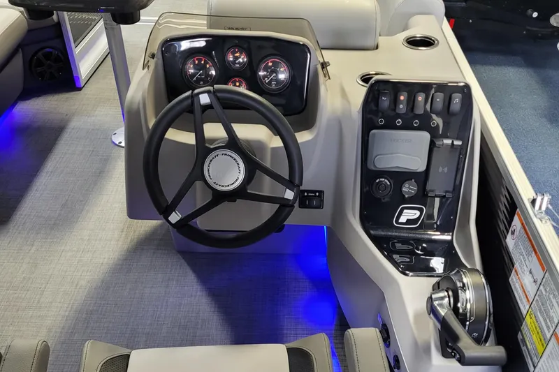 Slide: The Image of 2025 Princecraft Vectra 21 RL boat dashboard with steering wheel and illuminated controls. - 7