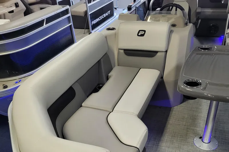 Slide: The Image of 2025 Princecraft Vectra 21 RL interior with gray seating and table. - 9