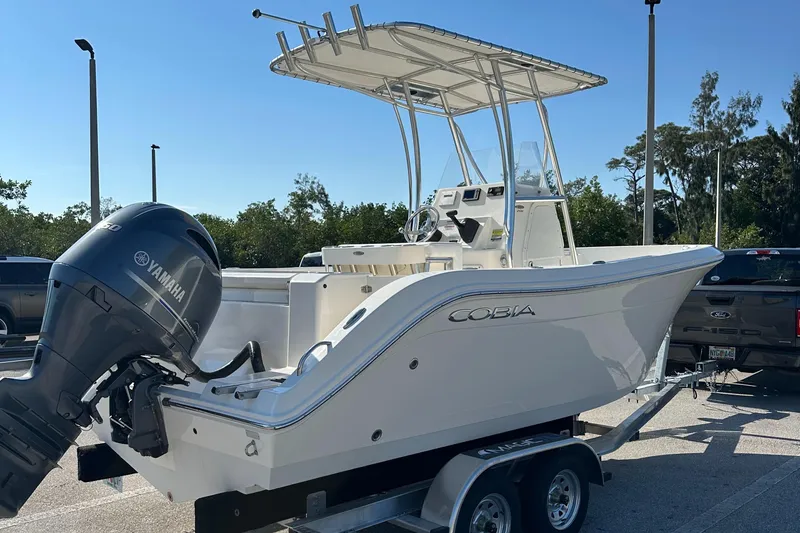 Slide: The Image of 2022 Cobia 201 Center Console boat on trailer with Yamaha outboard motor. - 4