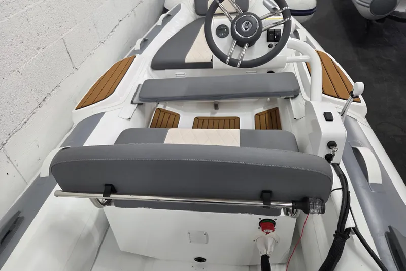 Slide: The Image of Interior of 2025 Gala A330HQ ELECTRIC boat with modern steering and seating. - 4