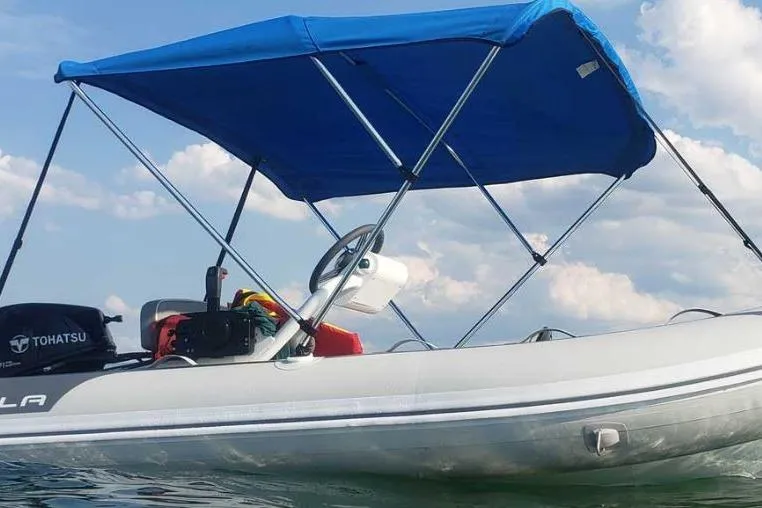 Slide: The Image of 2025 Gala A330HQ Electric boat with blue canopy on water, featuring Tohatsu engine. - 6