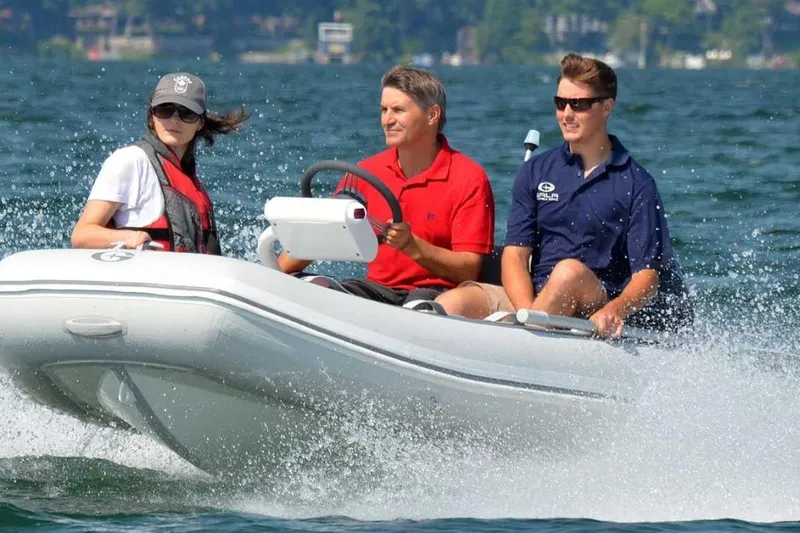Slide: The Image of Three people enjoying a ride on a 2025 Gala A330HQ ELECTRIC boat. - 8