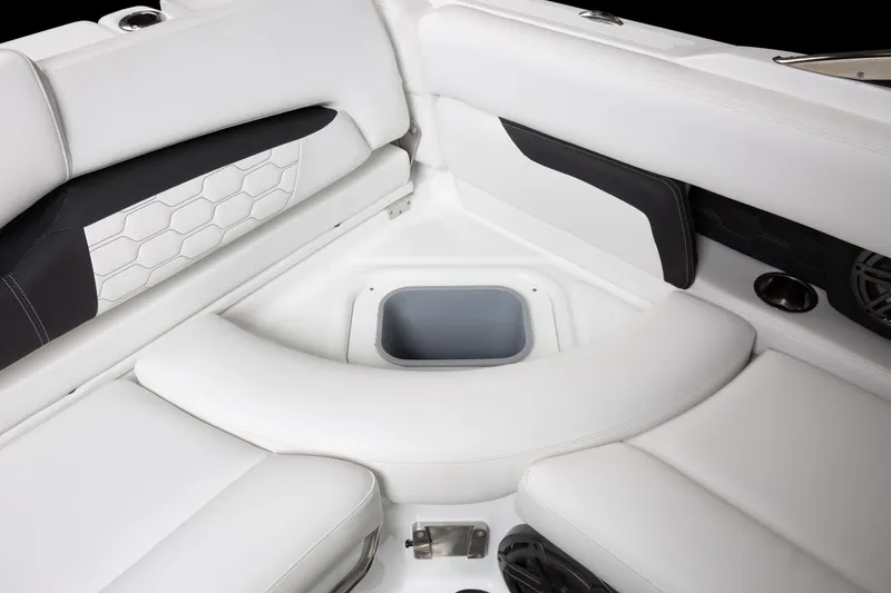 Slide: The Image of 2025 Four Winns HD5 OB boat interior with white seating and storage compartment. - 9