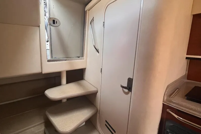 Slide: The Image of Interior of 2007 Sea Ray Amberjack boat with stairs and cabin door. - 27