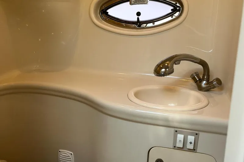 Slide: The Image of 2007 Sea Ray Amberjack bathroom with sink and oval window. - 30