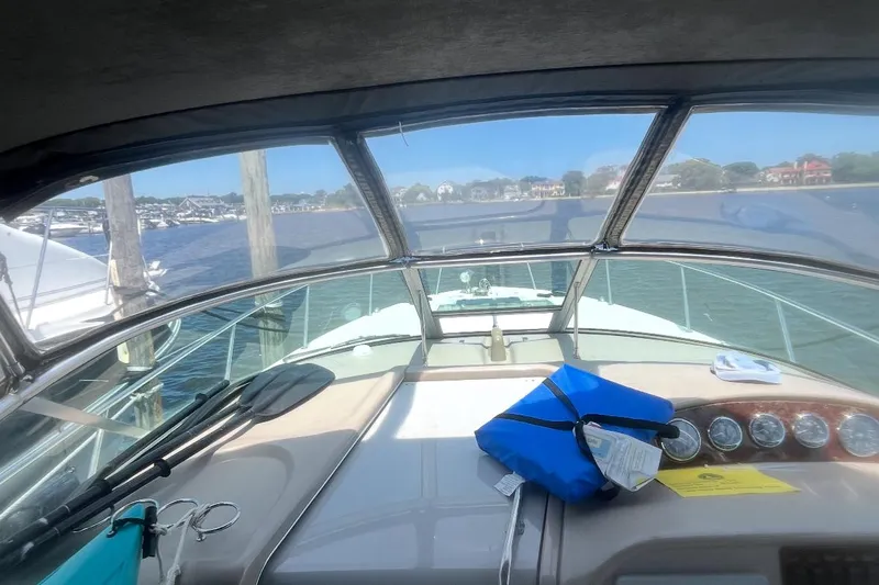 Slide: The Image of 2007 Sea Ray Amberjack boat cockpit with dashboard view, docked by the waterfront. - 33