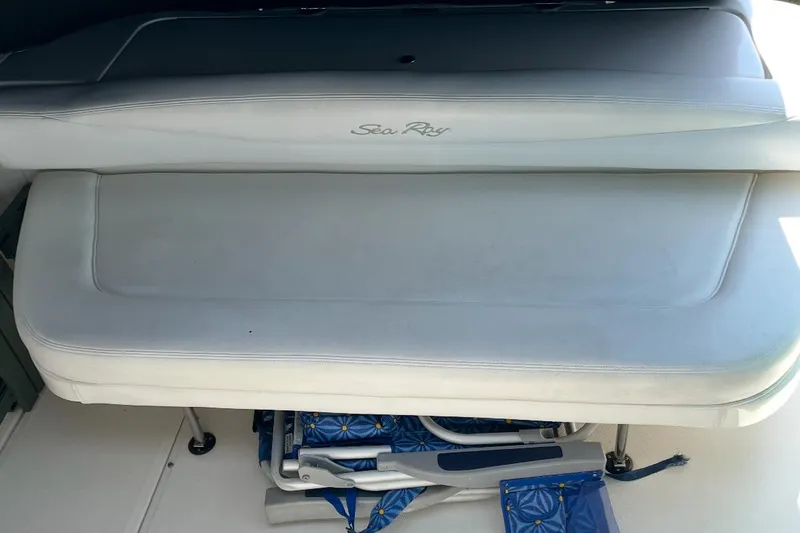 Slide: The Image of 2007 Sea Ray Amberjack boat seat with storage underneath, featuring a sleek white design. - 36