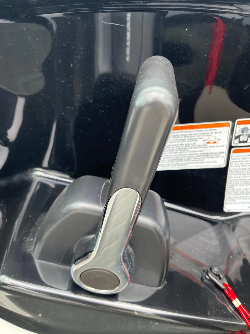 Slide: The Image of 2016 Yamaha Boats SX192 throttle lever with safety instructions in background. - 11