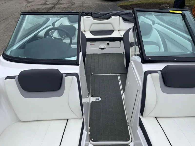 Slide: The Image of 2016 Yamaha Boats SX192 interior with white and gray seating, open cockpit view. - 2