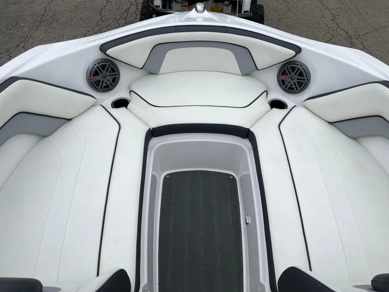 Slide: The Image of 2016 Yamaha Boats SX192 interior seating with speakers and white upholstery. - 3