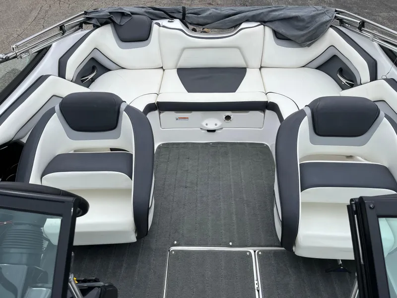 Slide: The Image of 2016 Yamaha Boats SX192 interior with sleek white and gray seating. - 5