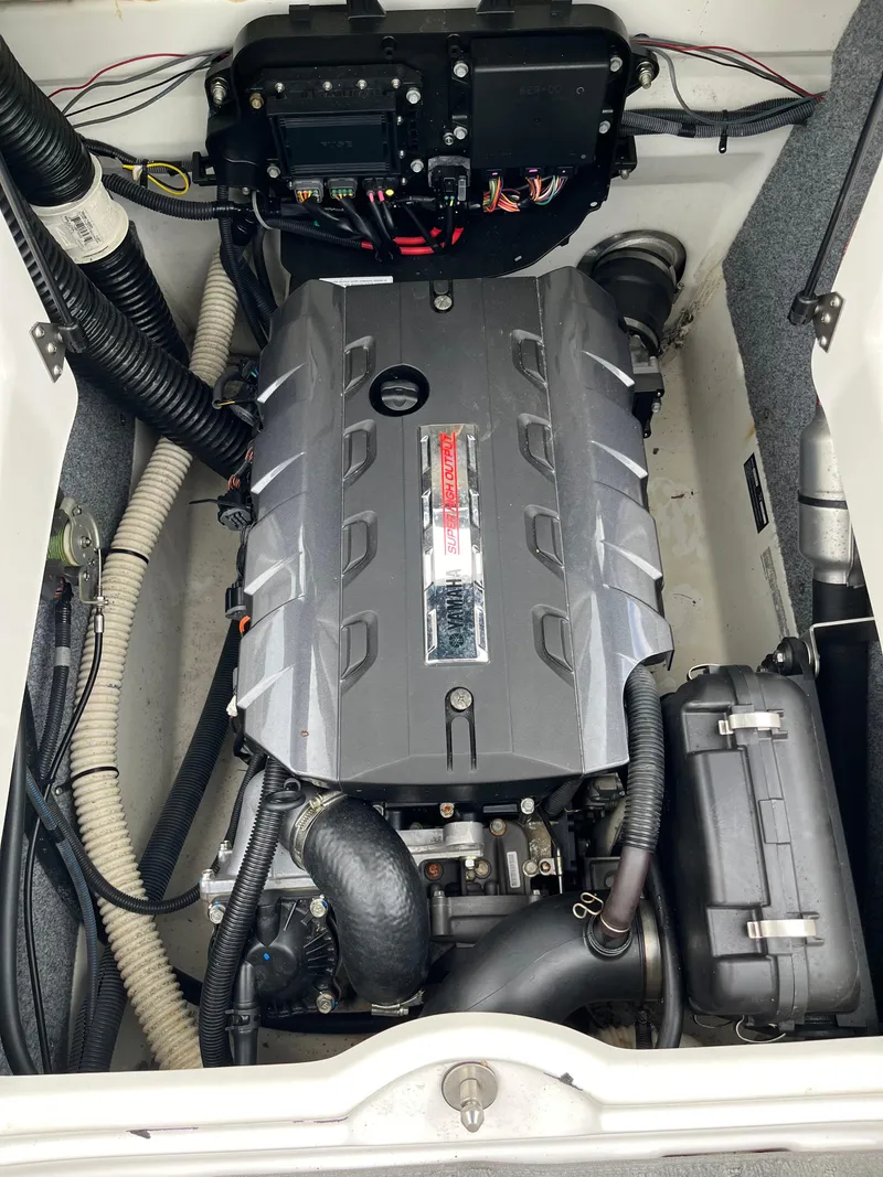 Slide: The Image of Engine compartment of a 2016 Yamaha Boats SX192, showcasing the engine and wiring. - 7