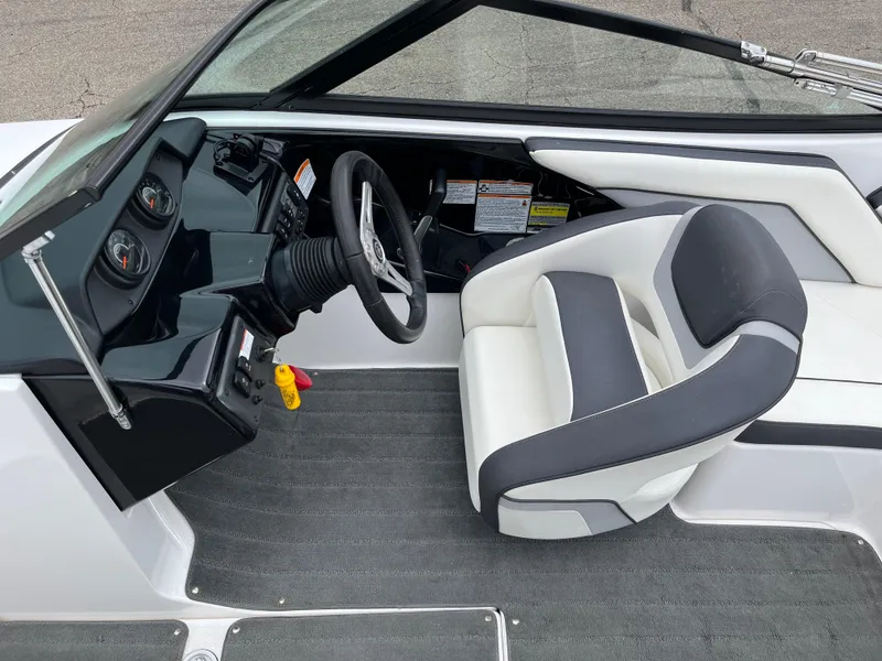 Slide: The Image of 2016 Yamaha Boats SX192 interior with steering wheel and seating. - 8