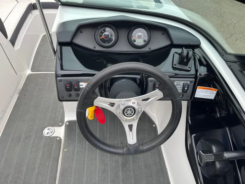 Slide: The Image of 2016 Yamaha Boats SX192 dashboard with steering wheel and instrument panel. - 9