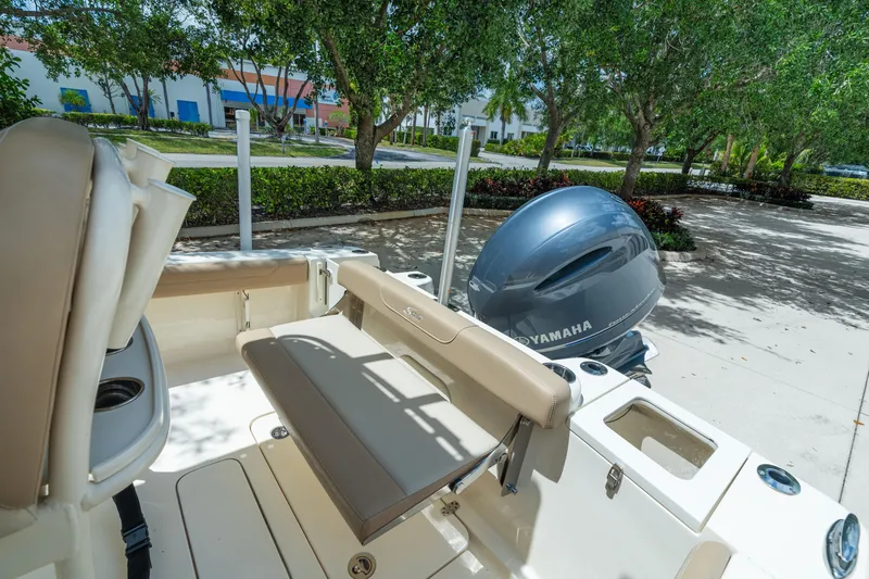 Slide: The Image of 2023 Scout 215 XSF boat with Yamaha engine, featuring comfortable seating and sleek design. - 13