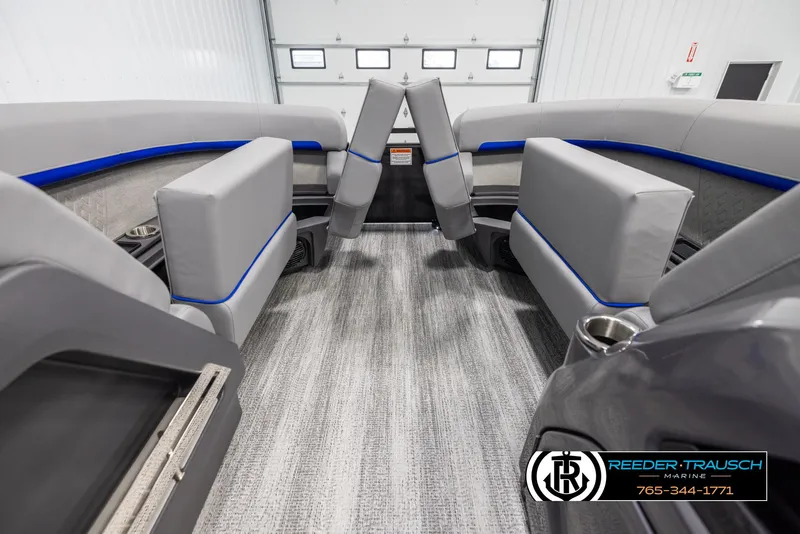 Slide: The Image of 2025 Bennington 22 MSBSE boat interior with gray seating and blue accents. - 19