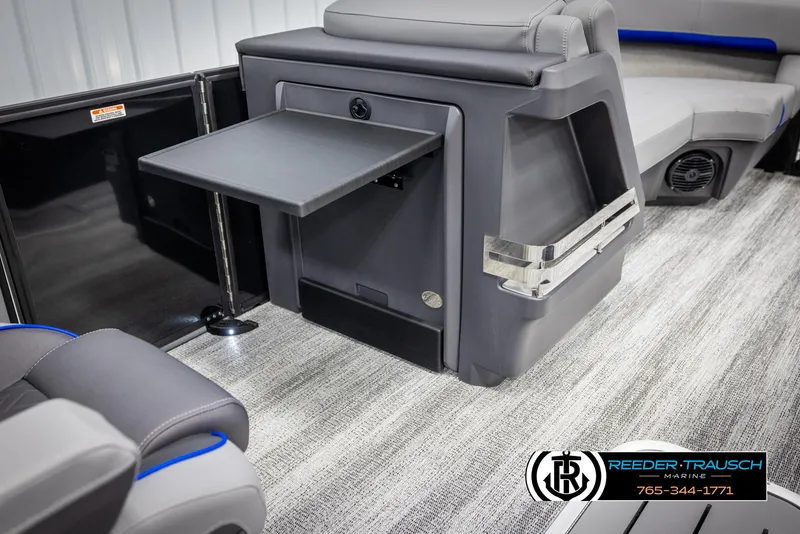 Slide: The Image of 2025 Bennington 22 MSBSE boat interior with fold-out table and seating. - 23