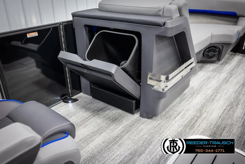 Slide: The Image of 2025 Bennington 22 MSBSE boat interior with storage compartment and seating. - 24