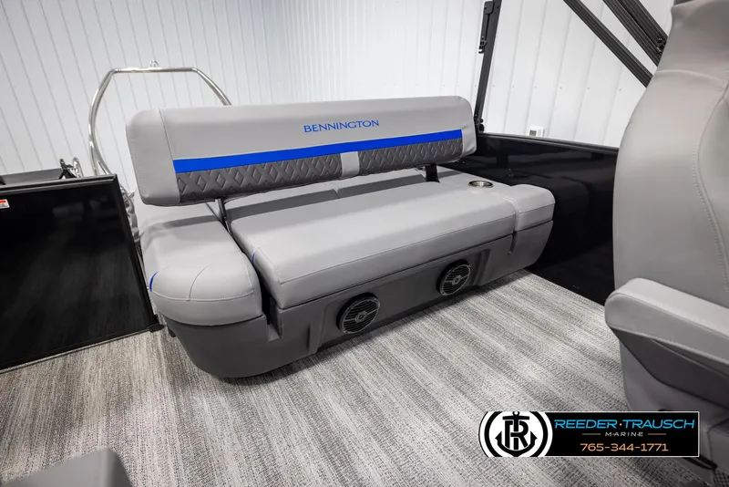 Slide: The Image of 2025 Bennington 22 MSBSE boat interior with gray seating and blue accents. - 25