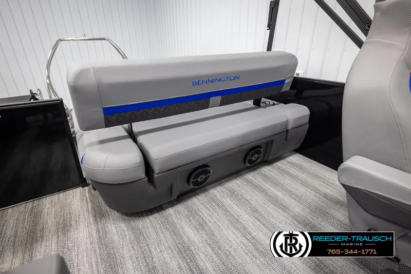 Slide: The Image of 2025 Bennington 22 MSBSE boat interior with gray seating and integrated speakers. - 26