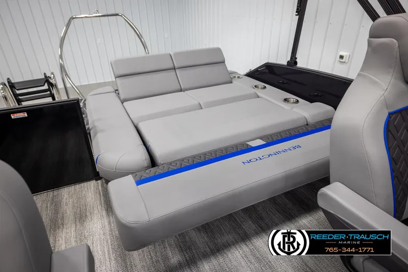 Slide: The Image of 2025 Bennington 22 MSBSE boat interior with gray seating and blue accents. - 28