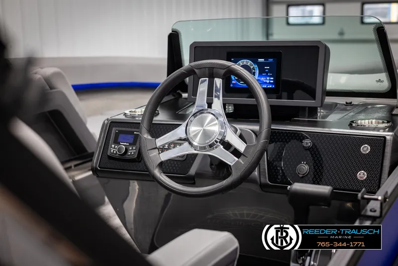 Slide: The Image of 2025 Bennington 22 MSBSE boat dashboard with modern steering wheel and digital display. - 32