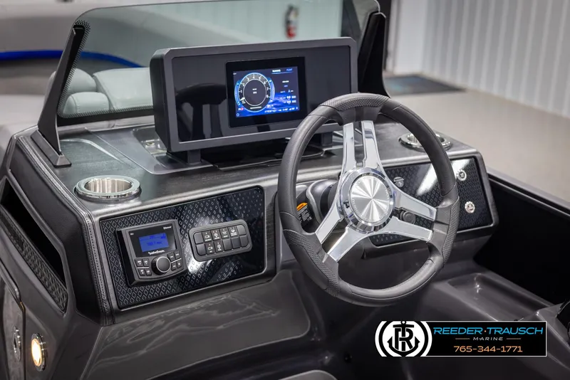 Slide: The Image of 2025 Bennington 22 MSBSE boat dashboard with modern steering wheel and digital display. - 33