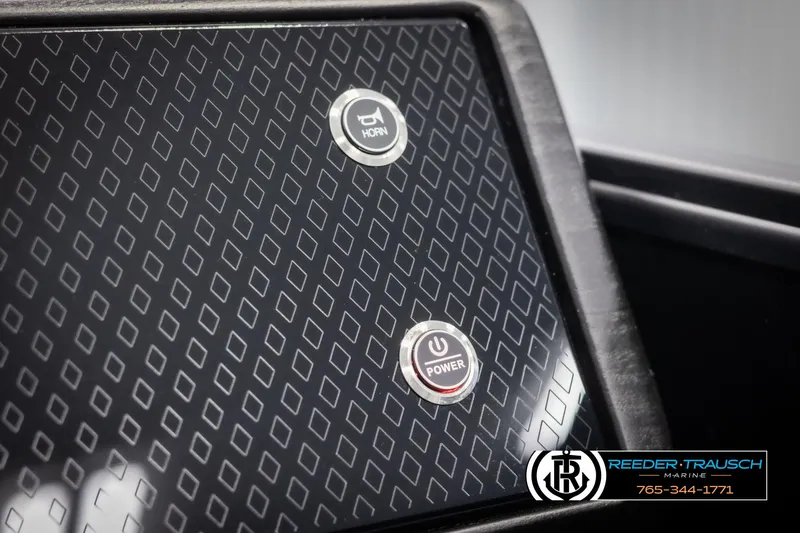 Slide: The Image of Dashboard of 2025 Bennington 22 MSBSE with horn and power buttons. - 38