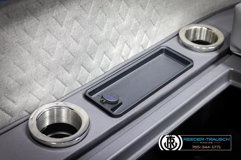Slide: The Image of 2025 Bennington 22 MSBSE boat console with cup holders and charging station. - 42