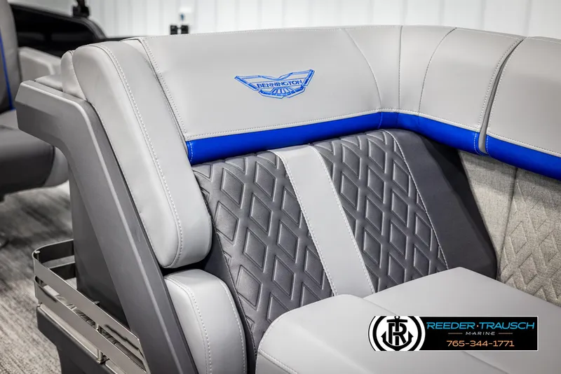 Slide: The Image of 2025 Bennington 22 MSBSE boat interior with gray and blue quilted seating. - 44