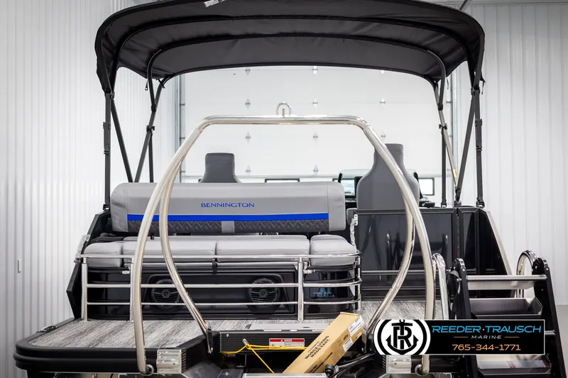 Slide: The Image of 2025 Bennington 22 MSBSE pontoon boat with canopy in showroom. - 7