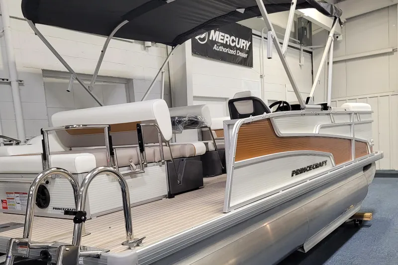Slide: The Image of 2025 Princecraft Vectra 21 RL pontoon boat in showroom with Mercury dealer sign. - 12
