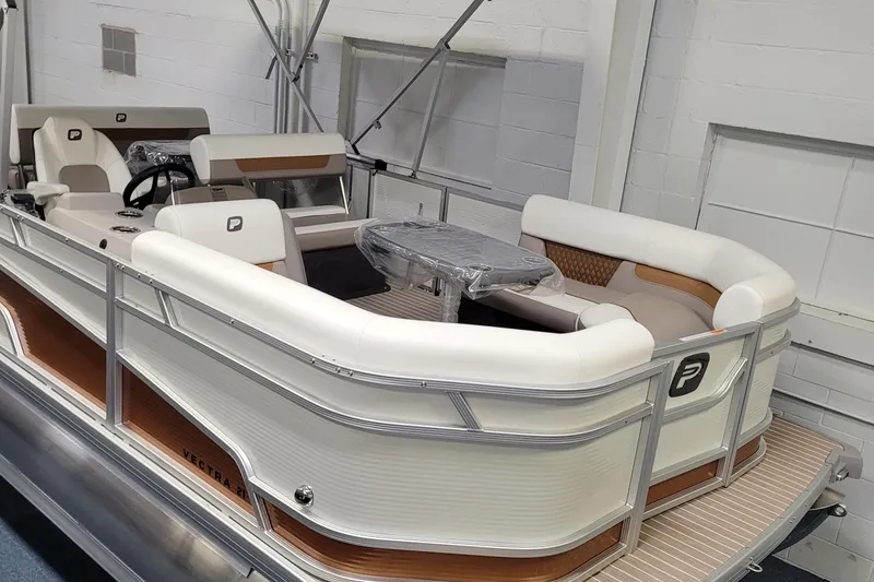 Slide: The Image of 2025 Princecraft Vectra 21 RL pontoon boat with white seating and modern design. - 13