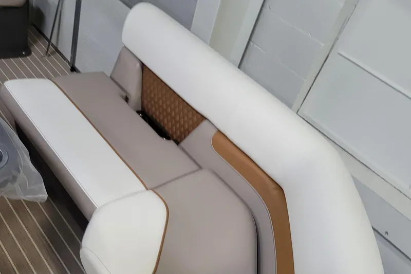 Slide: The Image of 2025 Princecraft Vectra 21 RL boat seating, beige and white upholstery with brown accents. - 3