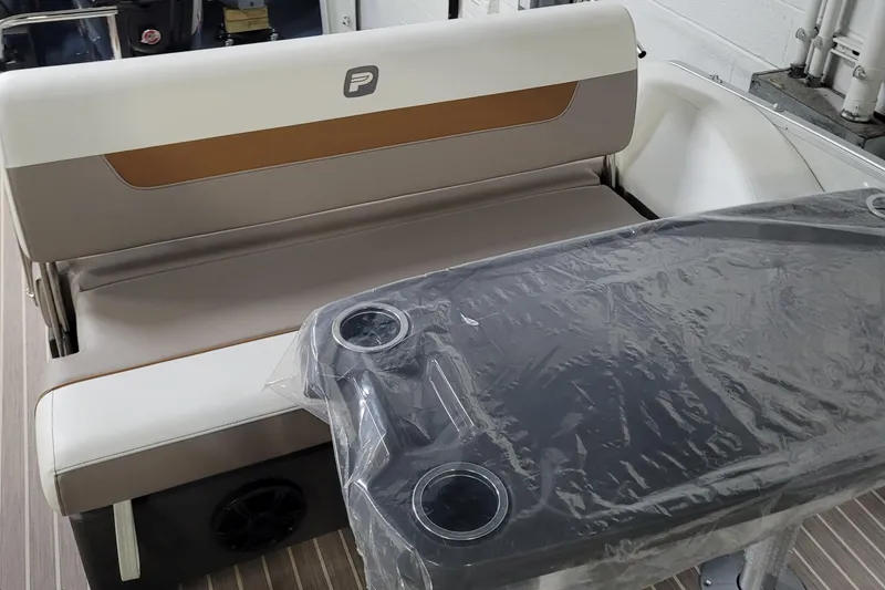Slide: The Image of 2025 Princecraft Vectra 21 RL boat interior with cushioned seating and table. - 6