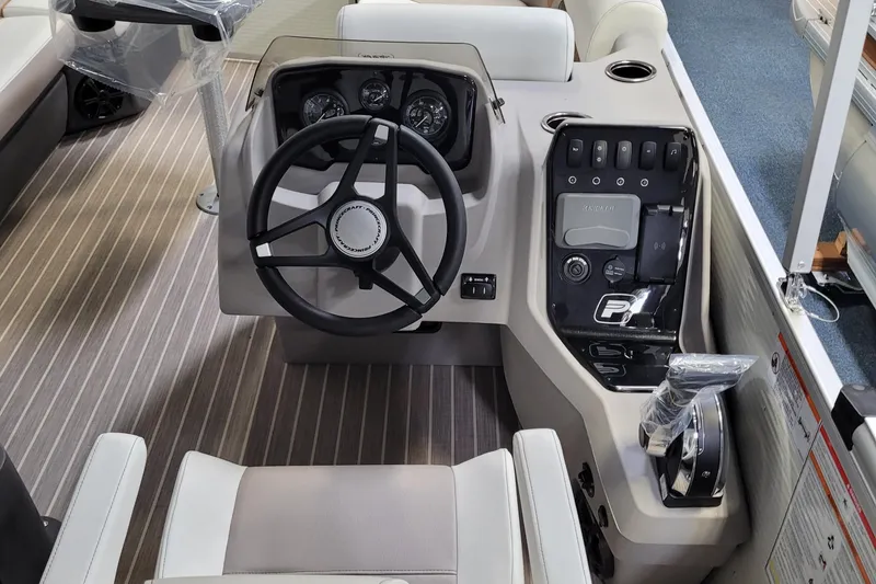Slide: The Image of 2025 Princecraft Vectra 21 RL boat cockpit with steering wheel and control panel. - 7