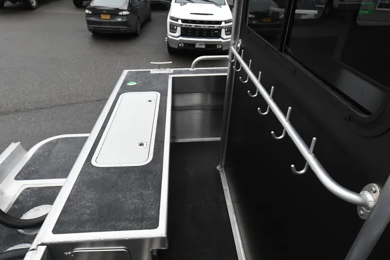 Slide: The Image of Custom 2025 24 LC vehicle interior with hooks and storage compartments. - 12