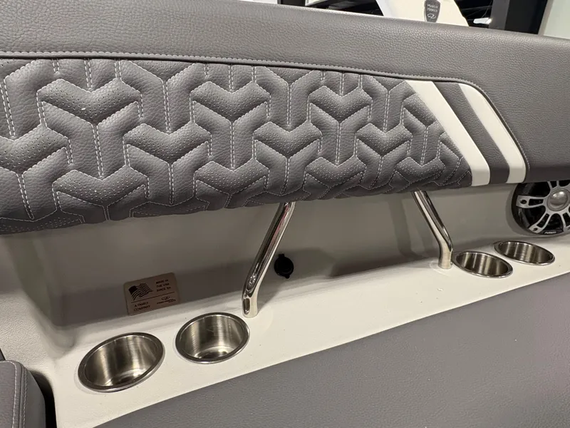 Slide: The Image of 2025 Regal LS6 interior with quilted gray upholstery and stainless steel cup holders. - 11