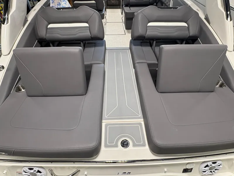 Slide: The Image of 2025 Regal LS6 boat interior with gray seating and modern design. - 13