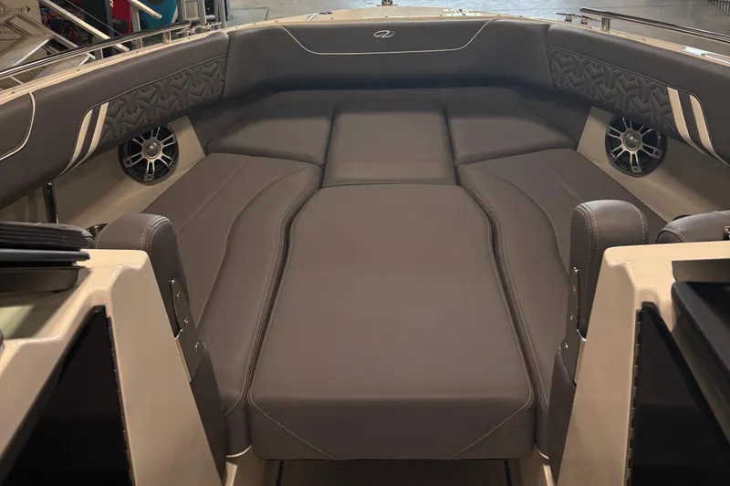 Slide: The Image of 2025 Regal LS6 boat interior with luxurious gray seating and modern design. - 21