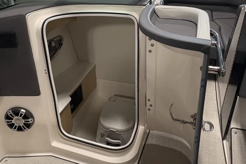 Slide: The Image of 2025 Regal LS6 boat interior with compact bathroom and modern amenities. - 29