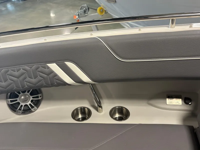 Slide: The Image of Interior of 2025 Regal LS6 boat with speaker and cup holders. - 3