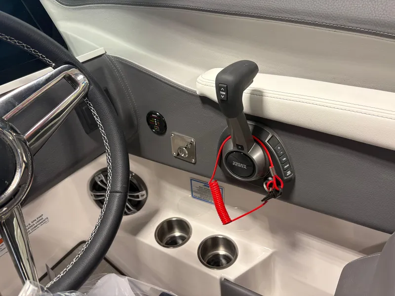 Slide: The Image of Interior of 2025 Regal LS6 boat showing steering wheel and control panel. - 6