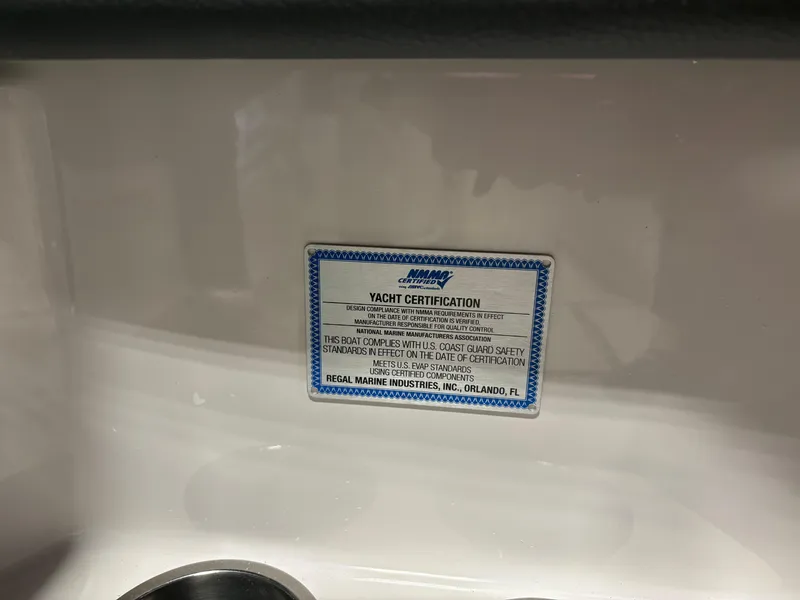Slide: The Image of Yacht certification label on 2025 Regal LS6 boat interior. - 7