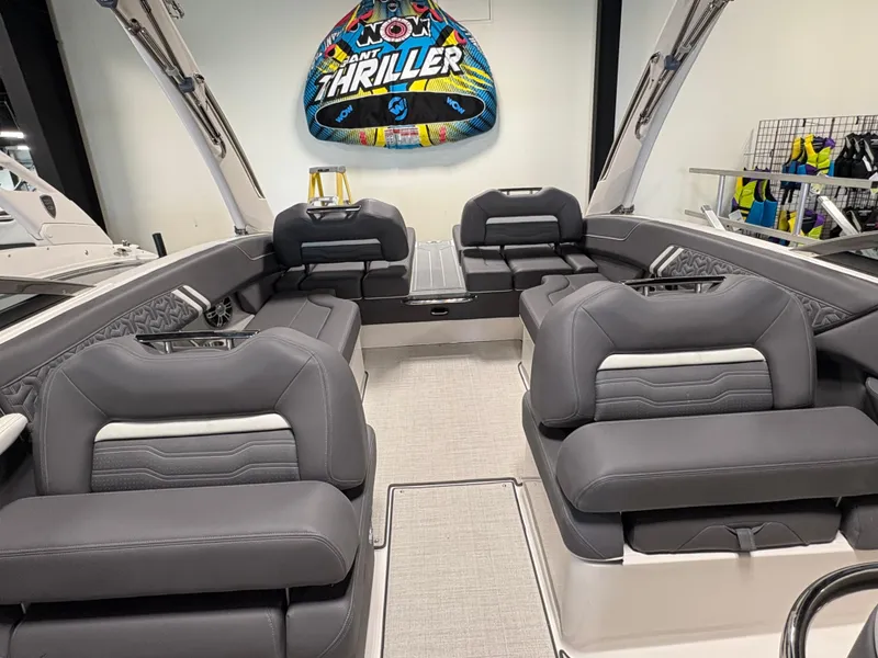 Slide: The Image of 2025 Regal LS6 boat interior with luxurious gray seating and a vibrant "Thriller" tube. - 8