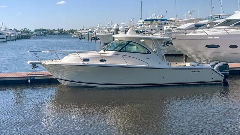 The Image of 2012 Pursuit OS 345 Offshore boat docked in a marina. - 1