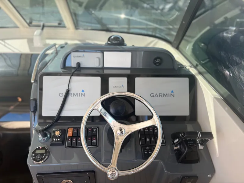 Slide: The Image of Control panel of 2012 Pursuit OS 345 Offshore boat with Garmin navigation system. - 6