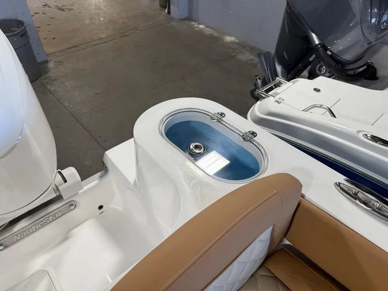 Slide: The Image of 2025 NauticStar 252 Legacy boat interior with livewell and seating. - 6