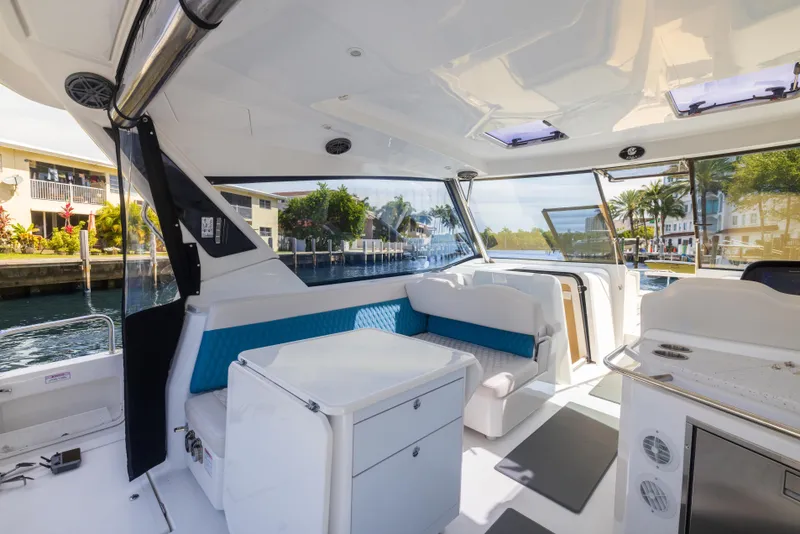 Slide: The Image of Interior of 2019 Aquila 36 Sport yacht with modern seating and waterfront view. - 10