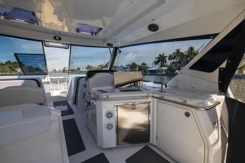 Slide: The Image of Interior of 2019 Aquila 36 Sport yacht with modern amenities and waterfront view. - 12